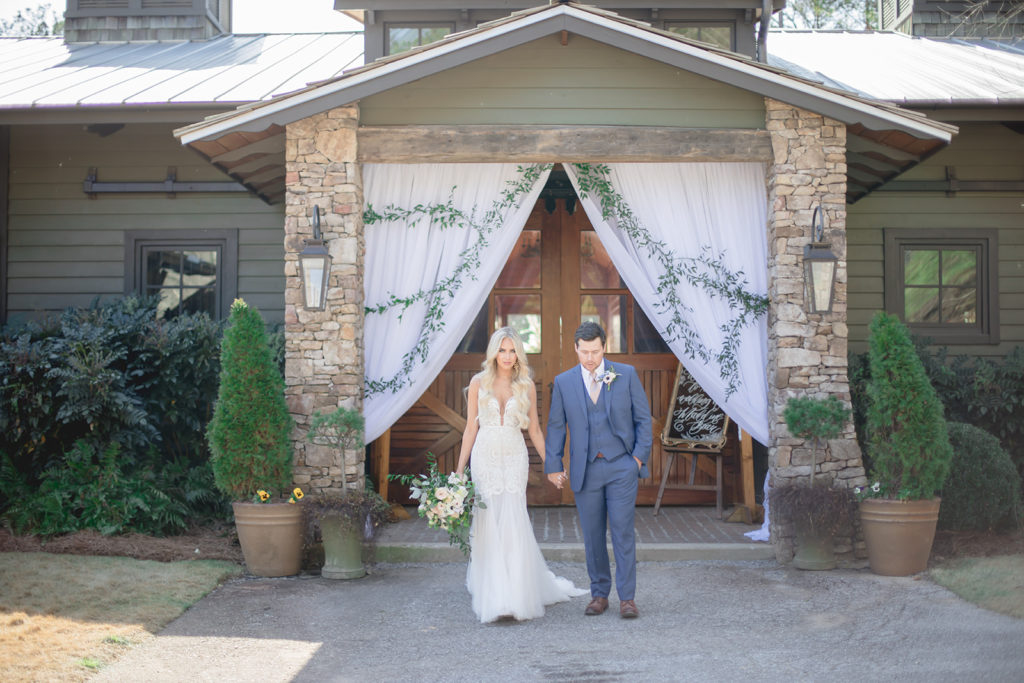 Bride and Groom Exiting Windwood Equestrian's Main Entrance at the Stables